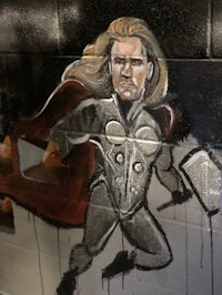 a mural of thor on a wall