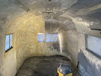 the interior of an airstream trailer is being painted