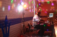 a man is playing a dj at a party