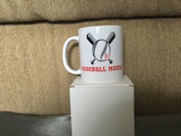 a coffee mug with baseball bats on it