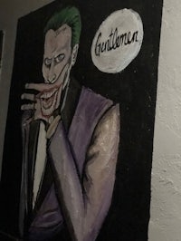 a painting of a joker on a wall