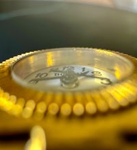 a close up of a gold watch