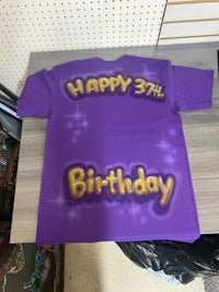 a purple t - shirt that says happy 3rd birthday