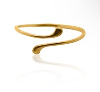 a gold plated cuff ring with a wave design