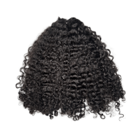 a black curly hair wig on a black background