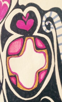 a close up of a drawing with a heart on it