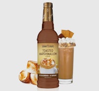 a bottle of toasted marshmallow with marshmallows next to it