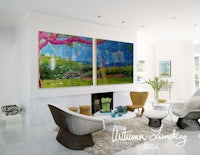a living room with a colorful painting on the wall