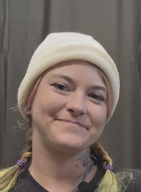a woman wearing a beanie and a hat